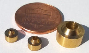 Small brass product pieces by Falmer manufactured on their screw machine